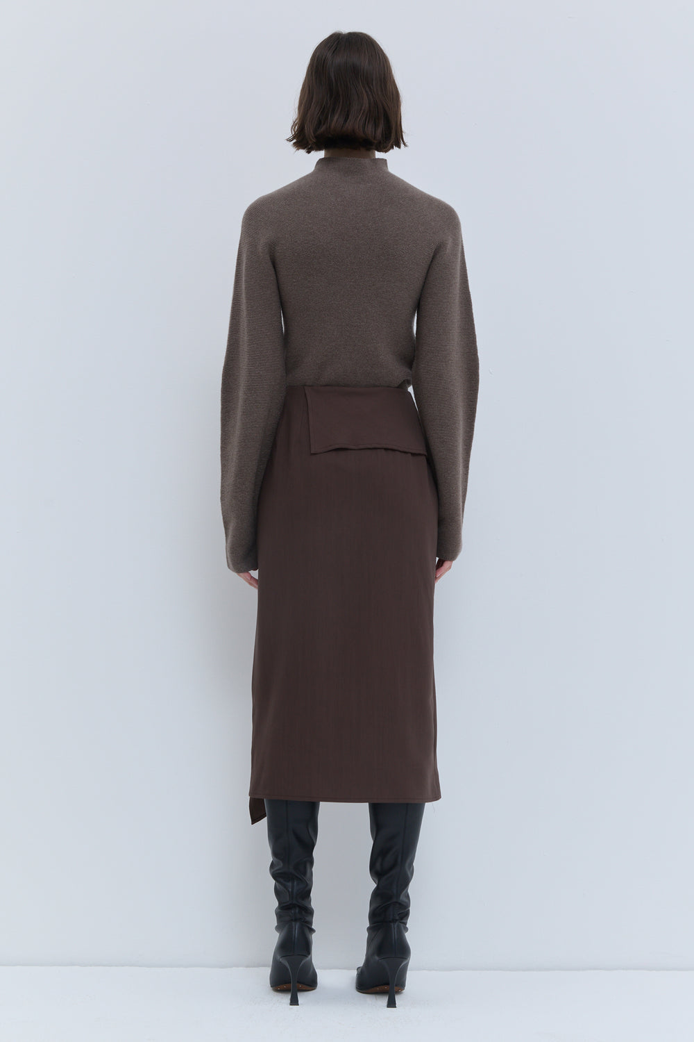 Christian Wijnants Sailo chestnut midi skirt with draped front panel, back view.