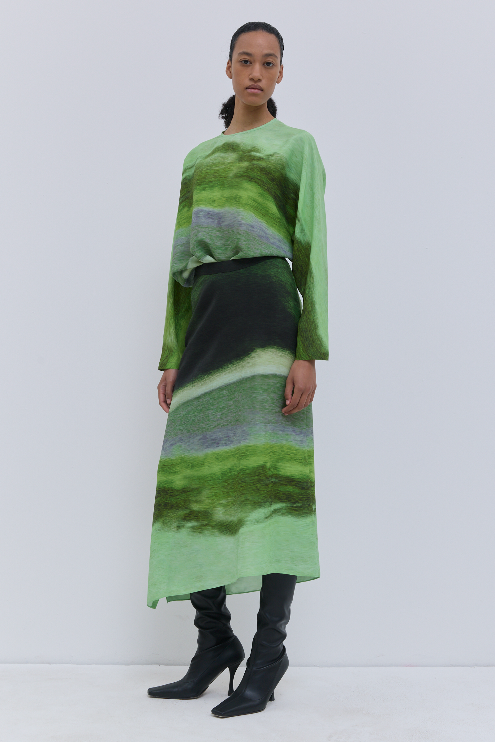 Green silk skirt with asymmetric hem and flowing fit