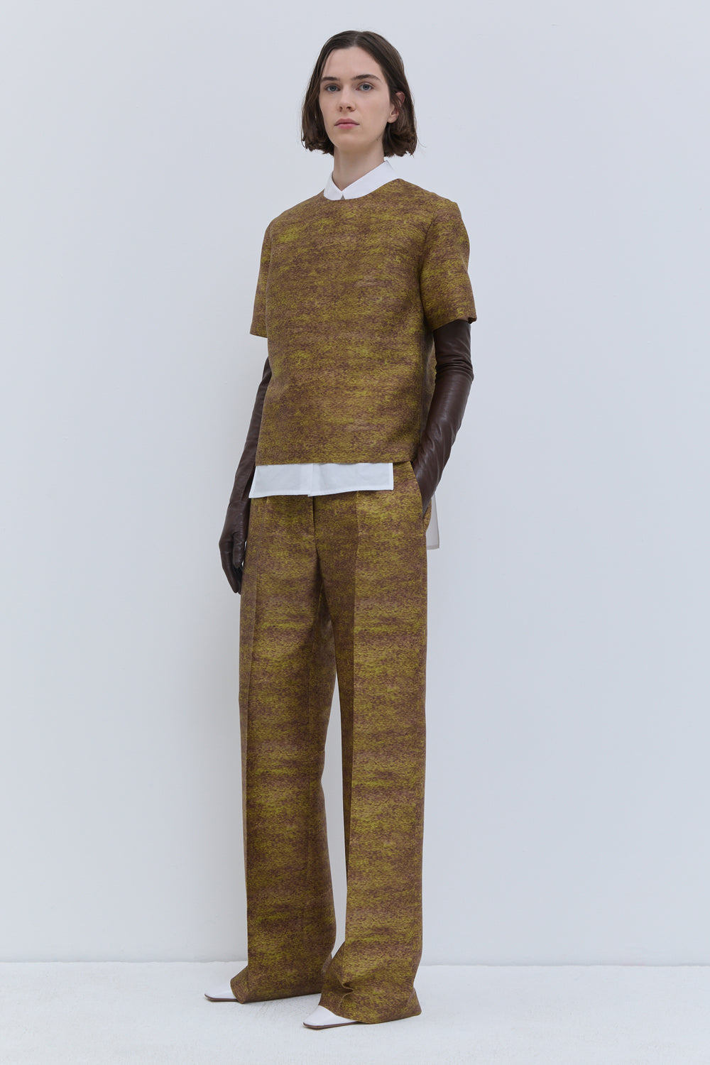 Gold Storm fitted top in printed wool and silk, styled with matching wide-leg trousers.