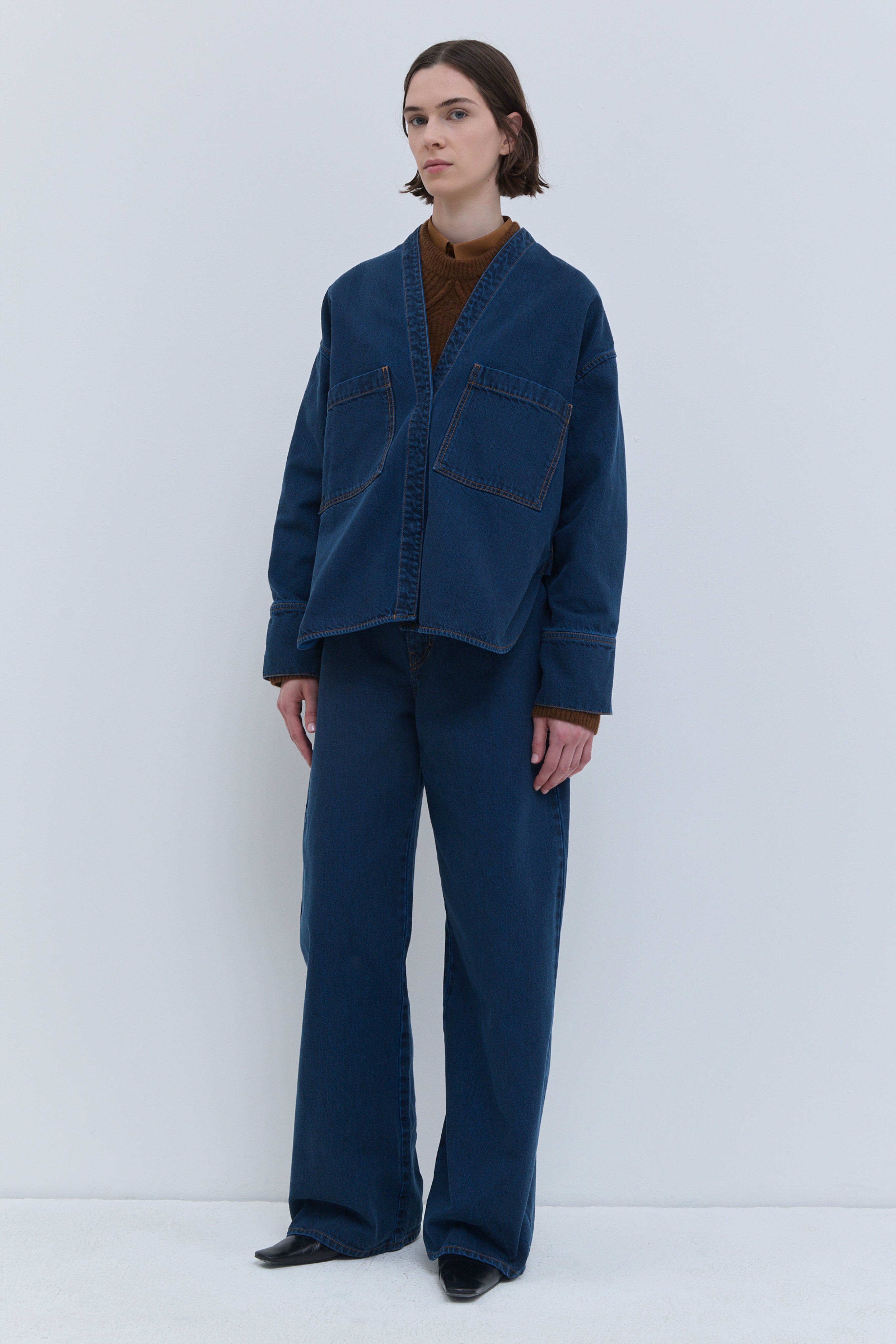 Taroski blue wash denim top, front view with V-neck and large chest patch pockets.
