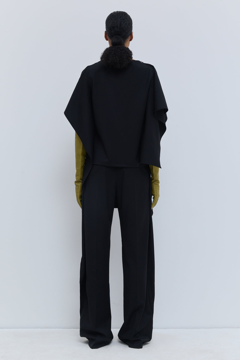 Black 100% virgin wool panel top styled with the flap detail worn across the front.